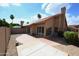 Expansive backyard features desert landscaping, a brick patio, and a red-tiled roof at 9285 E Sutton Dr, Scottsdale, AZ 85260
