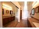 Bathroom features dual sinks, granite countertops, and a combined shower and bathtub at 9285 E Sutton Dr, Scottsdale, AZ 85260