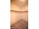 Walk-in closet features neutral carpeting and a hanging rod ready for ample storage at 9285 E Sutton Dr, Scottsdale, AZ 85260