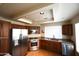 Well-lit kitchen featuring stainless steel appliances, granite countertops, and wooden cabinets at 9285 E Sutton Dr, Scottsdale, AZ 85260