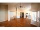 Inviting living room with hardwood floors and high ceilings, offering a view into the kitchen at 9285 E Sutton Dr, Scottsdale, AZ 85260