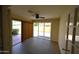 Bright sunroom with tile flooring, ceiling fan, and sliding doors leading to the backyard at 9285 E Sutton Dr, Scottsdale, AZ 85260