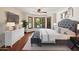 Relax in this cozy bedroom with hardwood floors, bay windows, and ample natural light at 9349 E Calle De Valle Dr, Scottsdale, AZ 85255