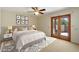 Bedroom with stylish decor, including framed art and patio access through wood-framed glass doors at 9349 E Calle De Valle Dr, Scottsdale, AZ 85255