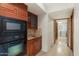 Hallway offers built-in microwave and oven, a marble-topped sink, and access to the laundry area at 9349 E Calle De Valle Dr, Scottsdale, AZ 85255