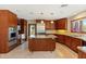 Gourmet kitchen features granite countertops, a center island, and stainless steel appliances at 9349 E Calle De Valle Dr, Scottsdale, AZ 85255