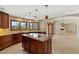 This spacious kitchen offers an island cooktop, stone counters and abundant natural light at 9349 E Calle De Valle Dr, Scottsdale, AZ 85255