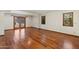 The empty main bedroom boasts hardwood floors, natural light, and private access to the patio at 9349 E Calle De Valle Dr, Scottsdale, AZ 85255