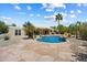 Serene pool area surrounded by lush landscaping and desert flora for a peaceful retreat at 9349 E Calle De Valle Dr, Scottsdale, AZ 85255