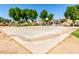 Outdoor community basketball court with mature trees at 935 E Agua Fria Ln, Avondale, AZ 85323