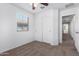 Bedroom with window and closet with sliding doors at 935 E Agua Fria Ln, Avondale, AZ 85323