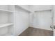 Walk-in closet featuring ample shelving, hanging space and carpeted floors at 935 E Agua Fria Ln, Avondale, AZ 85323