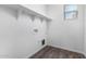 Laundry room with shelving and wood-look flooring at 935 E Agua Fria Ln, Avondale, AZ 85323