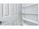 Pantry with white shelving and door at 935 E Agua Fria Ln, Avondale, AZ 85323