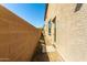 This side yard has a doorway leading to the home's interior at 935 E Agua Fria Ln, Avondale, AZ 85323