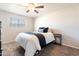 Neutral bedroom with a large window, ceiling fan, and carpeted floor at 1001 W 19Th St, Tempe, AZ 85281