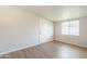 Inviting bedroom features wood-look floors, a large window, and neutral paint at 1001 W 19Th St, Tempe, AZ 85281