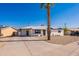 Charming single-story home featuring a desert-friendly landscape, a long driveway, and freshly painted white brick at 1001 W 19Th St, Tempe, AZ 85281