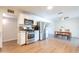 Bright kitchen boasts stainless steel appliances and white cabinetry, seamlessly flowing into the dining area at 1001 W 19Th St, Tempe, AZ 85281