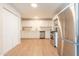 Bright, updated kitchen with stainless steel appliances, pristine white cabinetry and wood-look floors at 1001 W 19Th St, Tempe, AZ 85281
