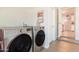 Convenient laundry room features modern washer and dryer, and leads to the kitchen at 1001 W 19Th St, Tempe, AZ 85281