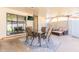 Charming covered patio with seating, a dining table, and sliding glass doors to the lawn at 1001 W 19Th St, Tempe, AZ 85281