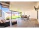 Relaxing covered patio with comfortable seating and dining area, perfect for outdoor entertaining at 1001 W 19Th St, Tempe, AZ 85281