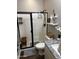 Bathroom features a step in shower and wood look tile flooring at 10704 E Twister Ave, Mesa, AZ 85212