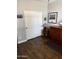Bedroom with dark wood-look tile floors and double door closet at 10704 E Twister Ave, Mesa, AZ 85212