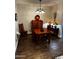 Formal dining room with decorative chandelier and wooden furniture at 10704 E Twister Ave, Mesa, AZ 85212
