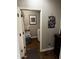 Interior laundry room with dark wood-look tile floors and light grey walls at 10704 E Twister Ave, Mesa, AZ 85212