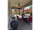 Covered patio featuring a ceiling fan, outdoor furniture, and a built-in grill at 10704 E Twister Ave, Mesa, AZ 85212