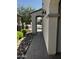 This side yard offers a covered walkway, pavers, and desert rock landscaping at 10704 E Twister Ave, Mesa, AZ 85212