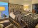Comfortable bedroom with a large bed, decorative lamps, and a closet at 11028 W Crimson Ln, Avondale, AZ 85392