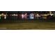 The property is located on a canal and is lit up at night with holiday lights at 11028 W Crimson Ln, Avondale, AZ 85392
