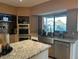 Updated kitchen with stainless steel appliances, granite countertops, and ample cabinet space at 11028 W Crimson Ln, Avondale, AZ 85392