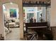 Bright and airy living room featuring large windows and a grand piano at 11028 W Crimson Ln, Avondale, AZ 85392