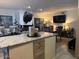 Open concept living room and kitchen area with plenty of counter space and seating at 11028 W Crimson Ln, Avondale, AZ 85392