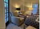 Cozy primary bedroom with sitting area, private patio access, and ample natural light at 11028 W Crimson Ln, Avondale, AZ 85392