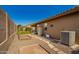 A private backyard featuring gravel landscaping, covered patio, and space for outdoor entertaining at 11242 E Onza Ave, Mesa, AZ 85212