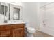 Clean bathroom featuring a wood vanity, toilet, and shower-tub combination at 11242 E Onza Ave, Mesa, AZ 85212