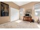 Cozy bedroom featuring neutral tones, a window, and a modern workstation at 11242 E Onza Ave, Mesa, AZ 85212