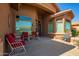 Inviting front porch with comfortable seating, perfect for relaxing and enjoying the neighborhood views at 11242 E Onza Ave, Mesa, AZ 85212