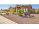 Charming single-story home with desert landscaping featuring rock and cactus accents at 11242 E Onza Ave, Mesa, AZ 85212
