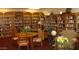 Cozy library with extensive bookshelves, comfortable seating, and a quiet atmosphere for reading at 11242 E Onza Ave, Mesa, AZ 85212
