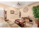 Cozy living room featuring a comfortable sofa, stylish decor, and a warm, inviting atmosphere at 11242 E Onza Ave, Mesa, AZ 85212