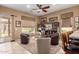 Open concept living room with full bar, tile floors, and access to a large sliding glass door at 11242 E Onza Ave, Mesa, AZ 85212