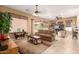 Inviting living room with a comfortable sofa, stylish bar, and bright natural light at 11242 E Onza Ave, Mesa, AZ 85212