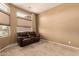 Comfortable room with a large window and neutral carpet, creating a cozy atmosphere at 11242 E Onza Ave, Mesa, AZ 85212