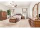 Spacious primary bedroom with carpet flooring, natural light and classic decor at 11242 E Onza Ave, Mesa, AZ 85212